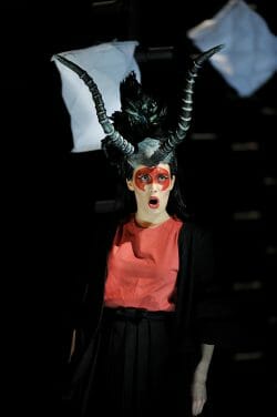 A photograph of a theater performer in costume, taken by Chris Christodoulou